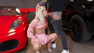 Candee Licious is sucking Juan Lucho's cock in the parking garage
